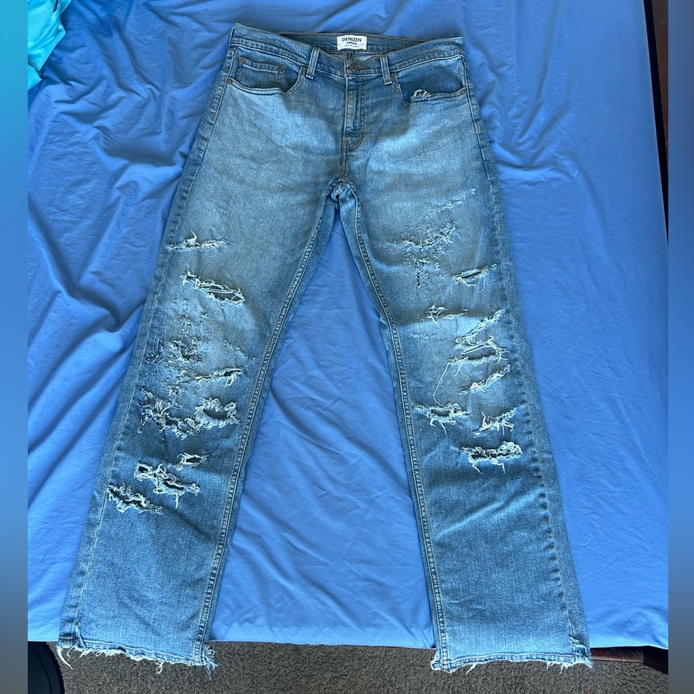 relaxed fit light blue distressed jeans